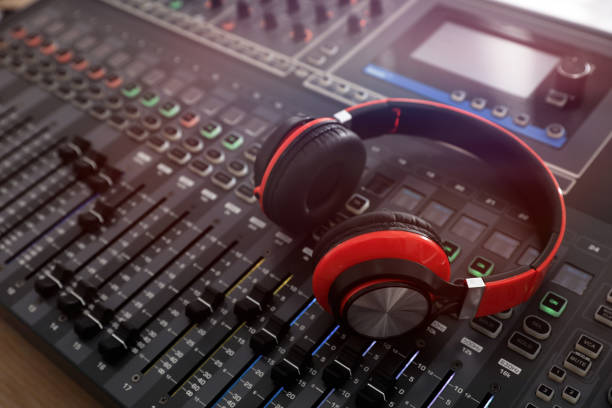 headphones on professional mixing console